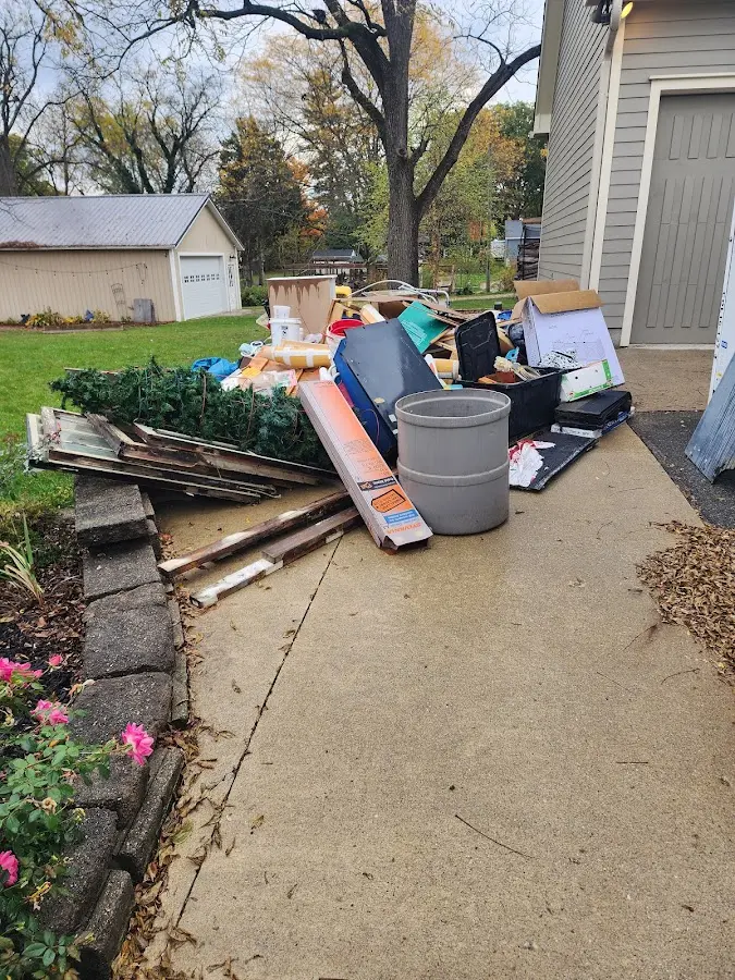 Dumpster being loaded with debris for Residential Dumpster Rental in Dimmitt
